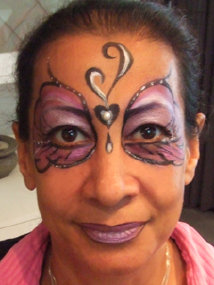 Face painted purple swirls
