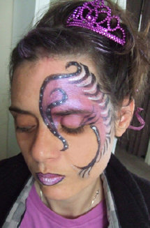 Face painted purple swirls